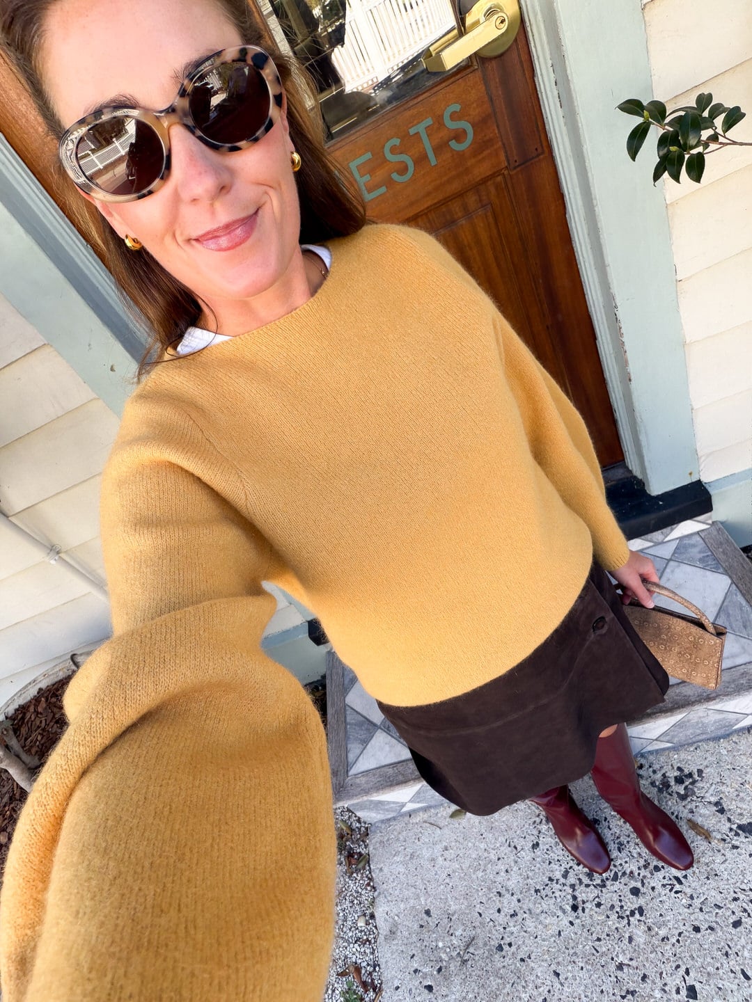 sezane yellow sweater and suede skirt